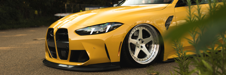 Front shot of BMW G80 M3 bagged on Bag Riders Super Low Air Suspension